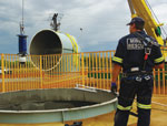 Shaft camera being lowered down a raised bore hole to check if it is safe to raise trapped mine workers.